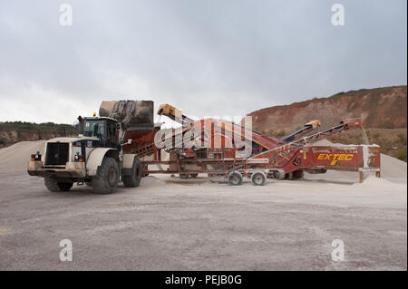 Aggregate is processed to separate and collect the finer material as a process of cement making at whitwell quarry, derbyshire uk. Stock Photo