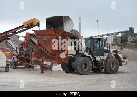 Aggregate is processed to separate and collect the finer material as a process of cement making at whitwell quarry, derbyshire uk. Stock Photo