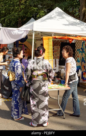 Two woman wearing traditional Japanese kimonos at the 2018 annual Powell Street Festival in Japantown, Vancouver, BC, Canada