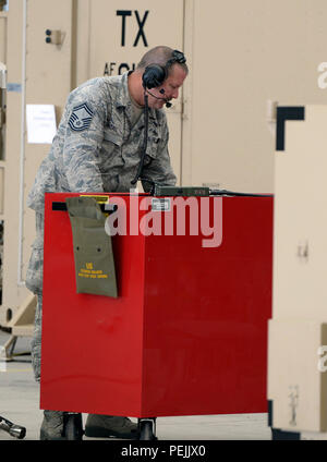 Senior Master Sgt. Christopher Randall, a communications infrastructure systems supervisor with the 147th Maintenance Group, 147th Reconnaissance Wing, Texas Air National Guard, based at Ellington Field Joint Reserve Base in Houston, inspects equipment Aug. 31, 2015, at Lielvarde Air Base, Latvia. The maintainers mobilized with other members of the wing to the Baltic nation where they deployed an entire MQ-1B Predator package, launching and recovering the first large-scale remotely piloted aircraft in Latvia. (Air National Guard photo by 1st Lt. Alicia Lacy/Released) Stock Photo