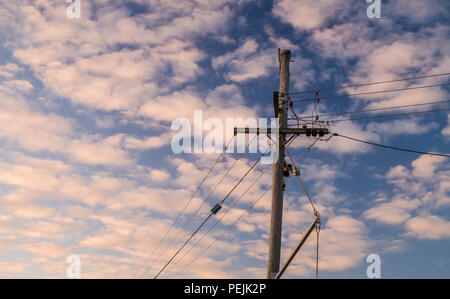 Wooden power pole with clouds during sunset in Perth, Western Australia, Oceania Stock Photo