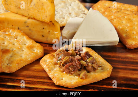 Black and green olive bruschetta with crackers and pepper jacck cheese Stock Photo