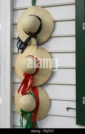 Straw hats decorating door in Colonial Williamsburg, VA, USA Stock Photo