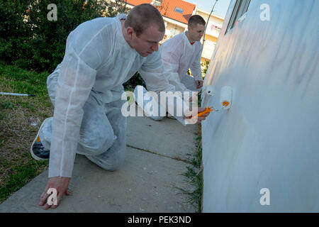 151207-N-ZN152-100 RUSILICA, CROATIA (Dec. 7, 2015) Aviation Electronics Technician Airmen M. Rasmussen (left), and N. Hilliard, assigned to aircraft carrier USS Harry S. Truman (CVN 75) remove graffiti from the Juraj Bonaci School for children with special needs during a community relations project. Harry S. Truman Carrier Strike Group is conducting naval operations in the U.S. 6th Fleet area of operations in support of U.S. national security interests in Europe and Africa. (U.S. Navy photo by Mass Communication Specialist 1st Class E.R. Scott/Released) Stock Photo