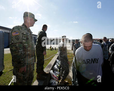 Role players prepare to go through a mass casualty decontamination line during Joint Task Force Civil Support's exercise Sudden Response 16-1, Dec. 8, 2015, at Fort Stewart, Ga. JTF-CS anticipates, plans and prepares for chemical, biological, radiological and nuclear response operations. (Official DOD photo by Navy Petty Officer 2nd Class Benjamin T. Liston) Stock Photo