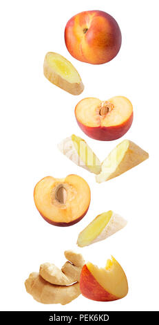 Isolated falling fruit. Flying fresh ginger and peaches isolated on white background with clipping path as package design element and advertising. Stock Photo