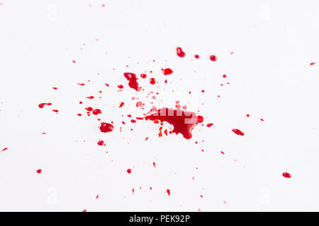 Splatter of red fountain pen ink on an isolated white background Stock Photo
