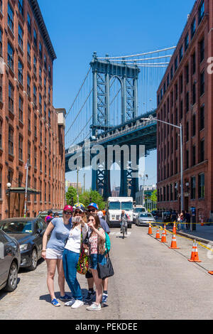 Tourists visiting Dumbo in Brooklyn Stock Photo