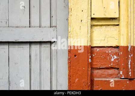 Old wall in orange, yellow and grey Stock Photo