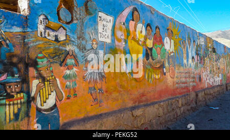 Landscape view of the surroundings of the town of Pumamarca in the Salta province of Northern Argentina, with decorated walls in the foreground Stock Photo
