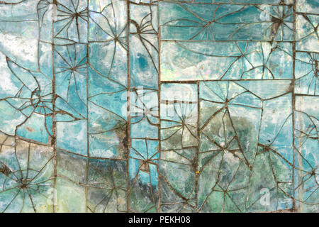Patterns of broken glass tile on the wall Stock Photo