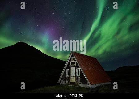 Emergency Mountain Hut / Shelter with the Northern Lights & Aurora Borealis, Snaefellsnes Peninsula, Iceland Stock Photo