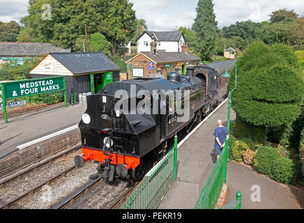 Ivatt 2MTT Class No 41312 at Medstead and Four Marks station with a train from Alresford to Alton on the Watercress Line preserved steam railway  15/0 Stock Photo