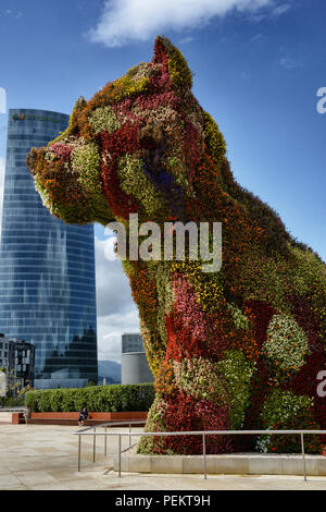 A view of Puppy, a floral sculpture by American artist Jeff Koons, at the Guggenheim Museum Bilbao. Bilbao, Spain Stock Photo