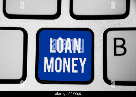 Word writing text Loan Money. Business concept for Something lent or furnished on condition being returned Keyboard blue key Intention create computer Stock Photo