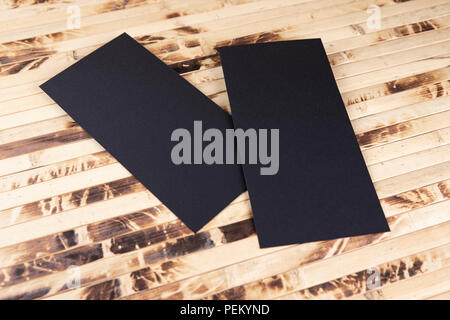 Blank flyer over wooden background to replace your design Stock Photo