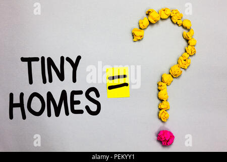 Conceptual hand writing showing Tiny Homes. Business photo showcasing houses contain one room only or two and small entrance Cheap Crumpled forming qu Stock Photo