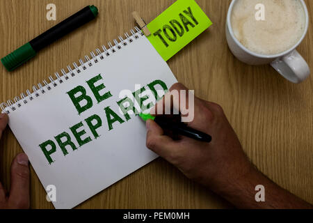 Conceptual hand writing showing Be Prepared. Business photo showcasing make something ready for use or consideration at future Man holding marker note Stock Photo