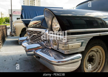 Novosibirsk, Russia - 06.07.2018: Old Russian classic car of the representative class produced in the Soviet Union Black GAZ 13 Chaika with chrome gra Stock Photo