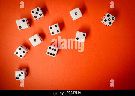 Many game dice on colorful background, gambling theme Stock Photo