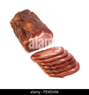 Piece of spanish Lomo Embuchado meat and slices isolated on white background Stock Photo