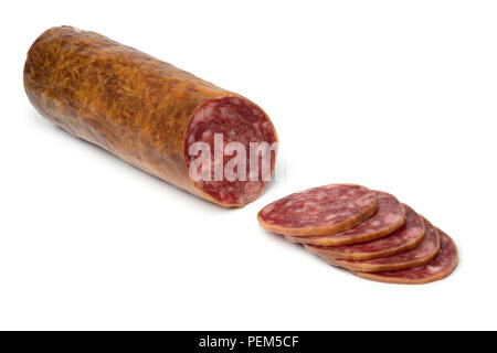 Traditional piece of Spanish Salchichon sausage and slices isolated on white background Stock Photo