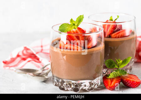Chocolate dessert of whipped cream and strawberries in glass. Stock Photo
