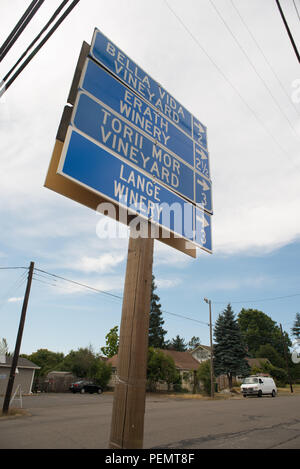 DUNDEE OREGON, AUGUST 15 2017, A Sign listing several wineries, and their distance down a road from downtown Dundee. Stock Photo