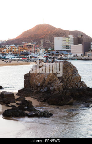 CABO SAN LUCAS, BCS, MEXICO - FEB 02, 2017: Group of youth spending the late afternoon by the public beach near the marina in Cabo San Lucas. Stock Photo
