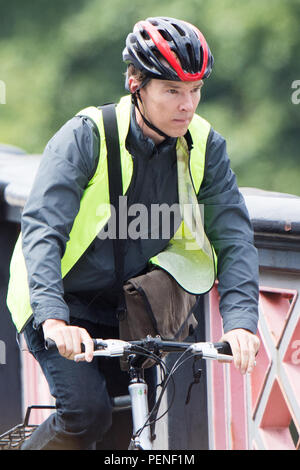 benedict-cumberbatch-riding-a-bike-across-lambeth-bridge-london