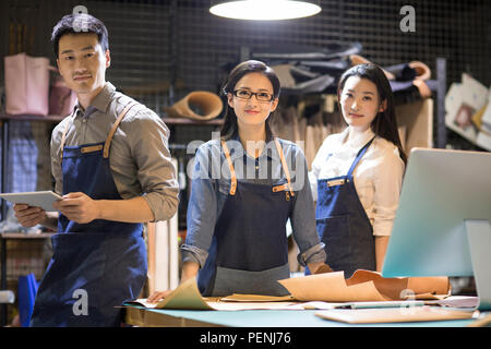 Confident leather craftspeople in studio Stock Photo