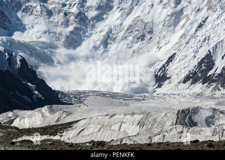 Avalanche coming down near Base Camp, Pabeda-Khan Tengry glacier massif, Central Tien Shan Mountain Range, Border of Kyrgyzstan and China, Kyrgyzstan, Stock Photo