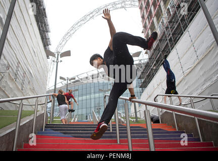 People performing Parkour outside Wembley Stadium in London, ahead of the Rendezvous International Parkour Gathering XIII 2018 at Wembley Park on August 18-19 weekend. Stock Photo