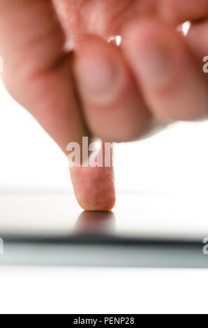 Rear view of male hand working on a modern touch pad. Stock Photo