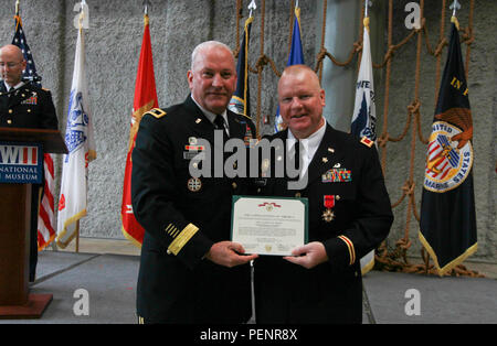 Four Soldiers from the 377th Theater Sustainment Command, with a ...