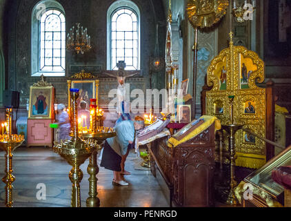 Jalta, Ukraine - August 16, 2012: Local faithfuls in prayer in the Alexander Nevsky orthodox church Stock Photo