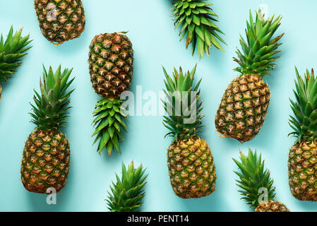 Fresh pineapples on blue background. Top View. Pop art design, creative concept. Copy Space. Bright pineapple pattern for minimal style Stock Photo