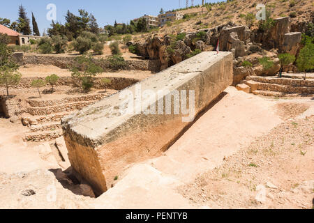 The Stone of the Pregnant is the largest carved stone in the world and lays unfinished in its quarry near the Baalbek roman temple complex, Lebanon. Stock Photo