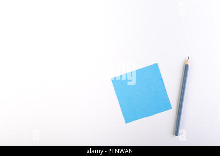 Blue blank sticky note with ordinery pencil. Stock Photo