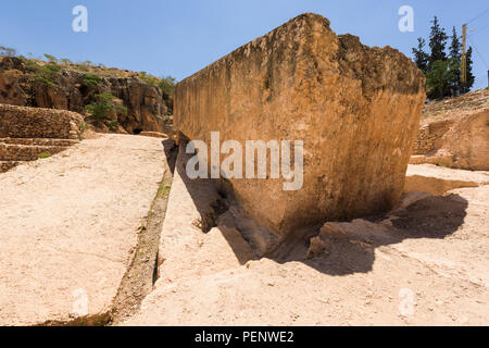 The Stone of the Pregnant is the largest carved stone in the world and lays unfinished in its quarry near the Baalbek roman temple complex, Lebanon. Stock Photo