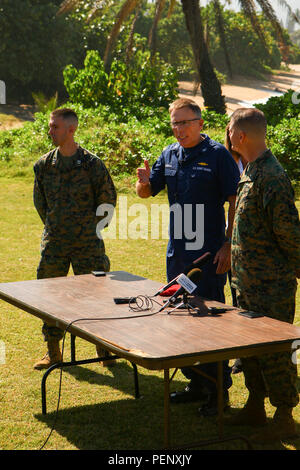 Capt. James Jenkins, Coast Guard 14th District Chief of Staff, speaks during a press meeting outside the John K. Kalili Surf Center in regards to the search and rescue efforts of two CH-53E Super Stallion helicopters, which were involved in an incident earlier this week off of the North Shore of Oahu, Hawaii, Jan. 17, 2016. The aircraft are from Marine Heavy Helicopter Squadron 463, MAG 24, 1st MAW from Marine Corps Base Hawaii. (U.S. Marine Corps photo by Lance Cpl. Maximiliano Rosas/ Released) Stock Photo