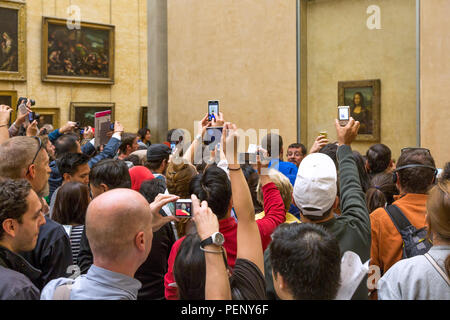Crowd surrounding the Mona Lisa painting, Musee du Louvre, Paris, France Stock Photo
