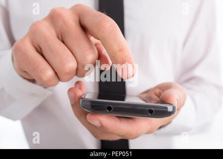 Close Up of Businessman Using Touch Screen Smartphone. Stock Photo