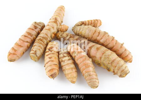 composition of fresh turmeric roots isolated on a white background Stock Photo