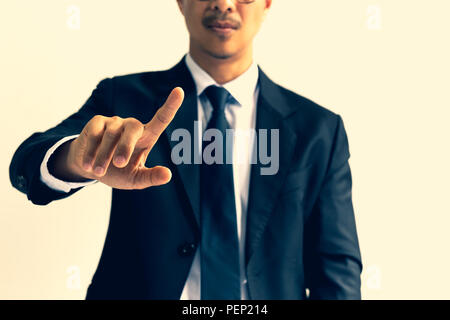 Businessman pointing his finger in cross process color. Stock Photo
