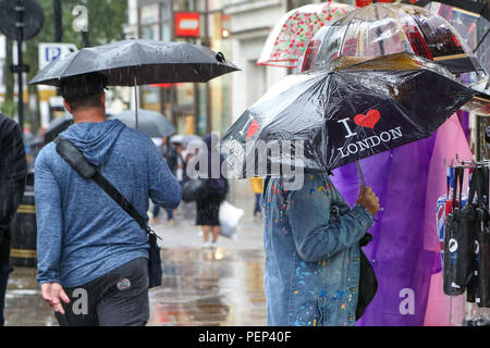 People sheltering from the rain beneath umbrellas walk past a Louis Vuitton  store in Roppongi. (Photo by Damon Coulter / SOPA Images/Sipa USA Stock  Photo - Alamy