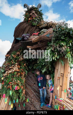 Glanusk Park, Brecon, Wales, 16th August 2018.  The first evening of the Green Man music festival in the Brecon Beacons Mountains in Wales. The site is opened the day before the festival proper. The huge Wicker Green Man sculpture is always one of the most popular areas. Credit: Rob Watkins/Alamy Live News Stock Photo