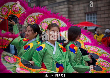 Edinburgh, Scotland, UK 17 August 2018. Edinburgh Fringe Royal Mile adding colour to the High Street Members of Soon Chun Hyang Uni English Drama  promote their joyful and never too serious The Merry Wives of Seoul as a new adaptation of The Merry Wives of Windsor, Shakespeare's comedy of love and marriage. Stock Photo