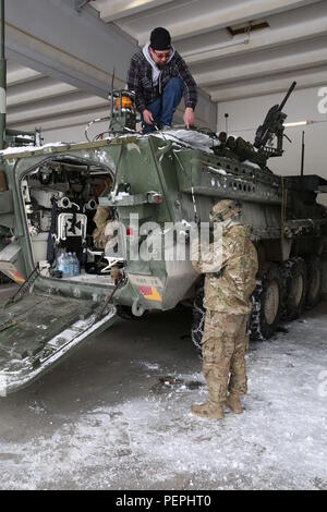 A MILES specialist installs Multiple Integrated Laser Engagement System ...