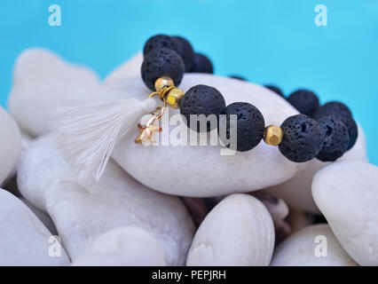 gemstone bracelet with black Lava beads and pendant starfish - volcano stones - semi precious stones jewelry Stock Photo